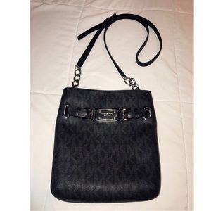 Michael Kors black cross body bag with logo.